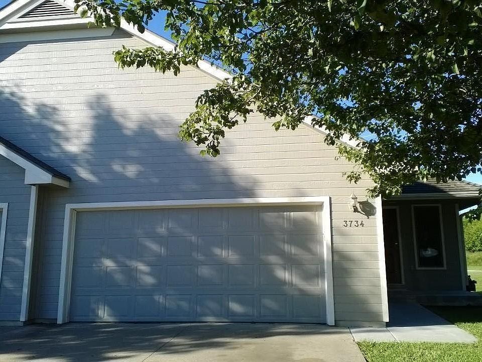 Oversized double car garage with keypad entry.