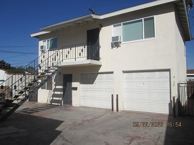 #1 / Rear Unit Stand Alone / Two Bedroom / 1 bath / Upstairs over Garage. Air conditioning and ceiling fans in every room.
