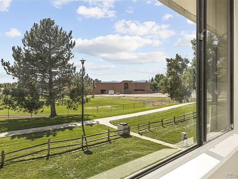View of green belt, walking path, and running track from upstairs bedroom.