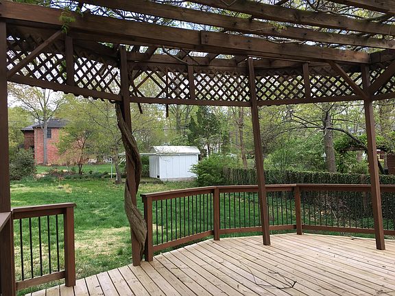 Vine-covered pergola; entryway to backyard and original astronomical observatory
