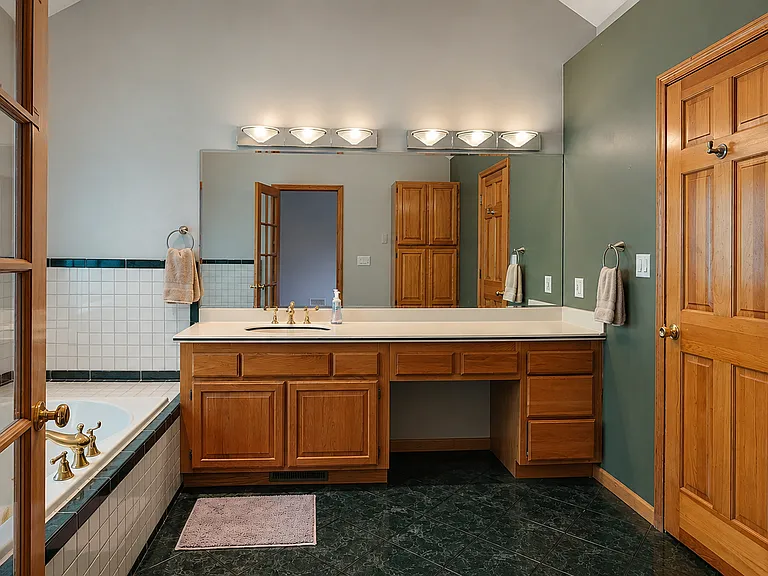 Primary bathroom. Door on the right is the shower/toilet room.