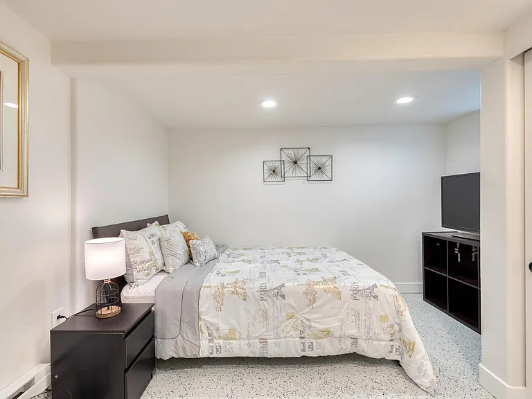 3rd bedroom in basement with full size bed