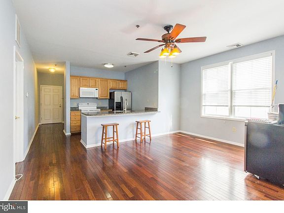 dark hardwood floors. open concept.