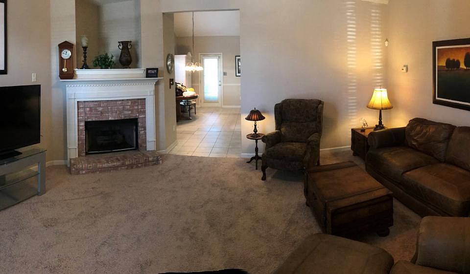 The great room with fireplace and vaulted ceiling