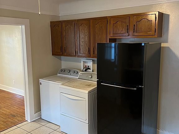 Kitchen includes water filtration, washer/dryer, and new refrigerator.
