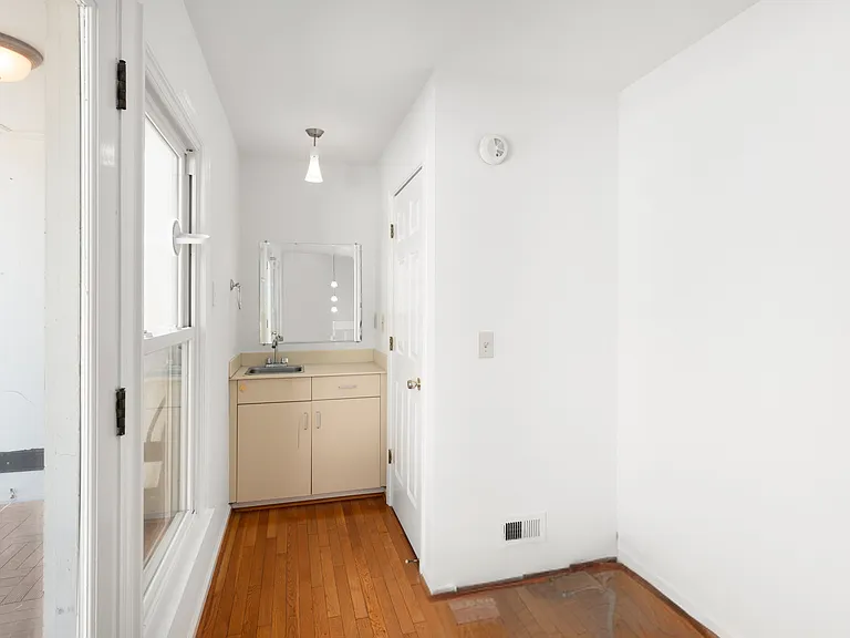 Half bath off of flex space and rooftop patio