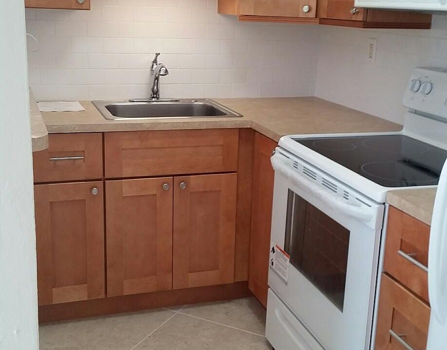Brand new kitchen with subway tile back splash.