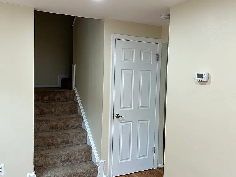 Stairwell to upstairs, basement entrance