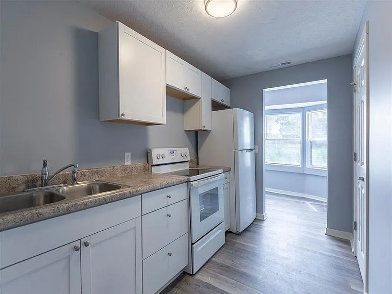 White cabinets in a unit at Park Avenue Apartments.