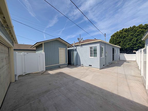 backyard, driveway, storage shed
