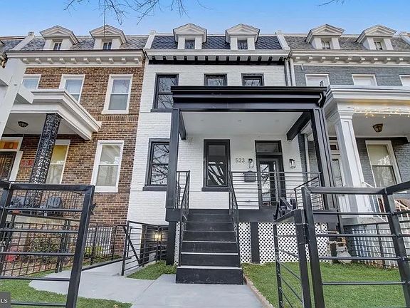 Gated Front Yard with Sidewalk to Stairs and LL Apt Entry