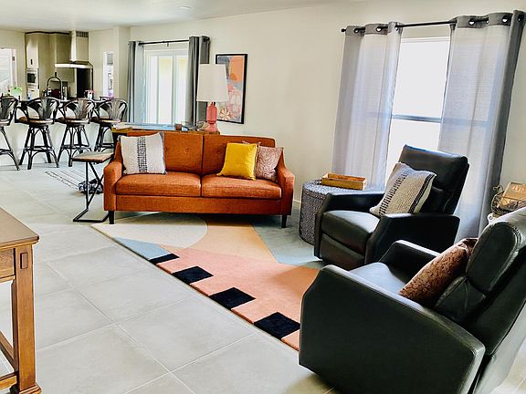 View of living space looking into open concept kitchen