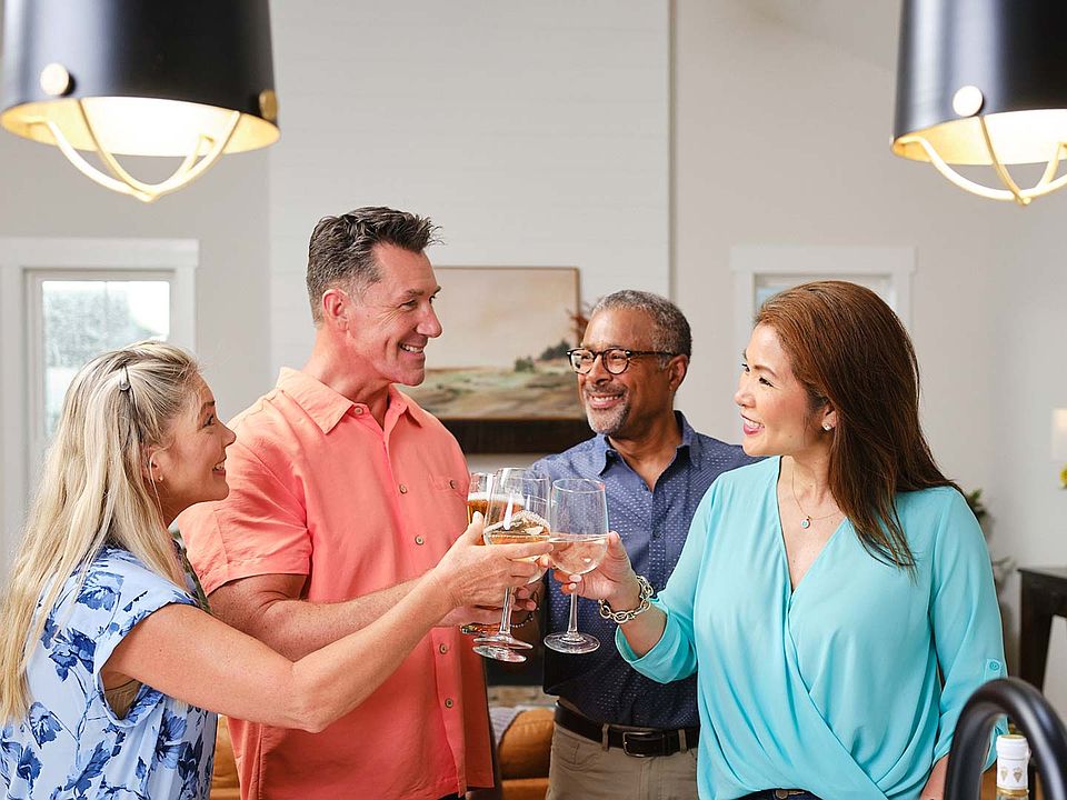 55 and older friends toasting drinks in a Landmark Homes 55 community