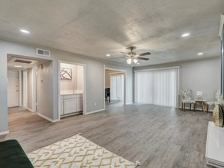 Huge living room with wet bar and patio access.