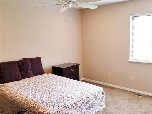 Good sized master with ceiling fan...