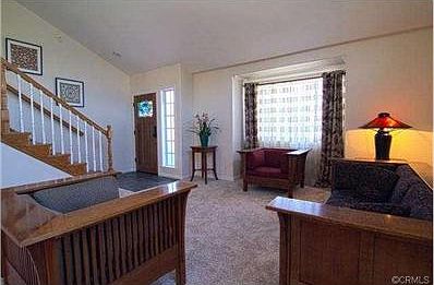 Living room; stairs lead up to 4 bedrooms upstairs