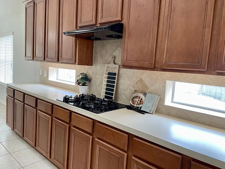 Gas cooktop with double glass panel providing abundant natural light.
