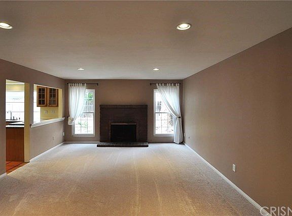 Living Room with Fireplace and recessed lighting.