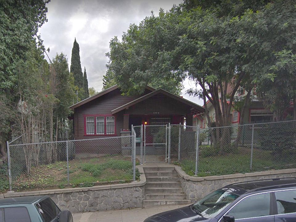 Front View of Residence - Note garage is located off alleyway in Rear.