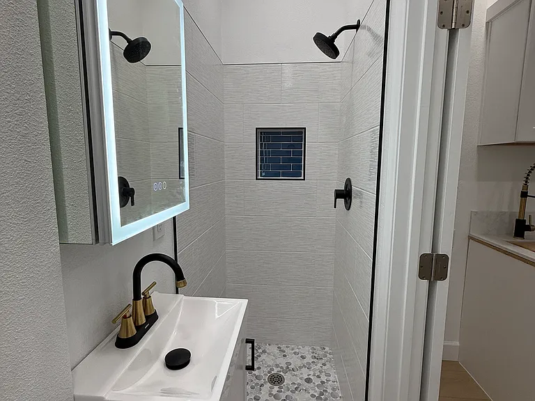 mirror that lights up and anti fog feature.
stunning tile shower
