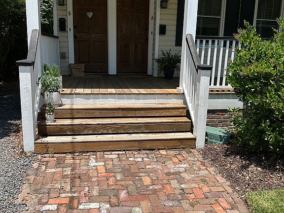 Nice brick pathway leads to your porch
