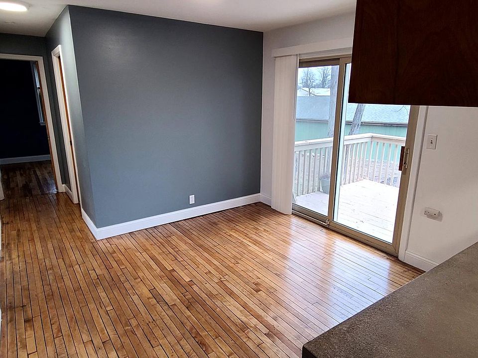View from kitchen, looking at dining room and down hallway to bedrooms.