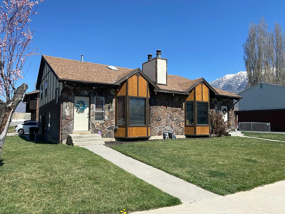 644 W is the unit on the left, parking on street and behind home