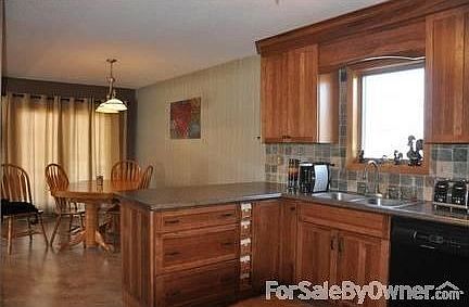 Kitchen and dinning room combo area
						:
						There are wide, deep drawers and a cute set of baskets for unique storage space