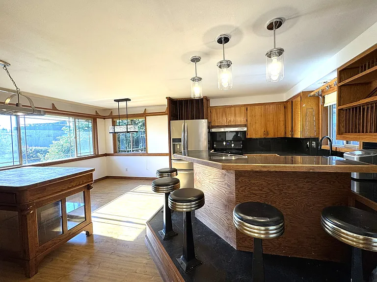 Grand kitchen with bar eating area