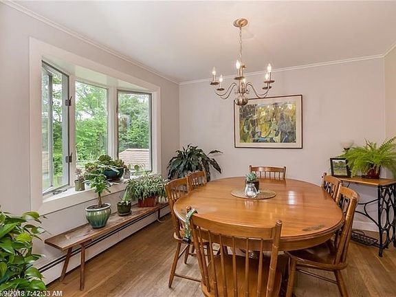The dining room over looks the back yard and is open to the kitchen and family room