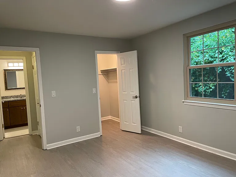 Spacious bedroom with large walk-in closet.