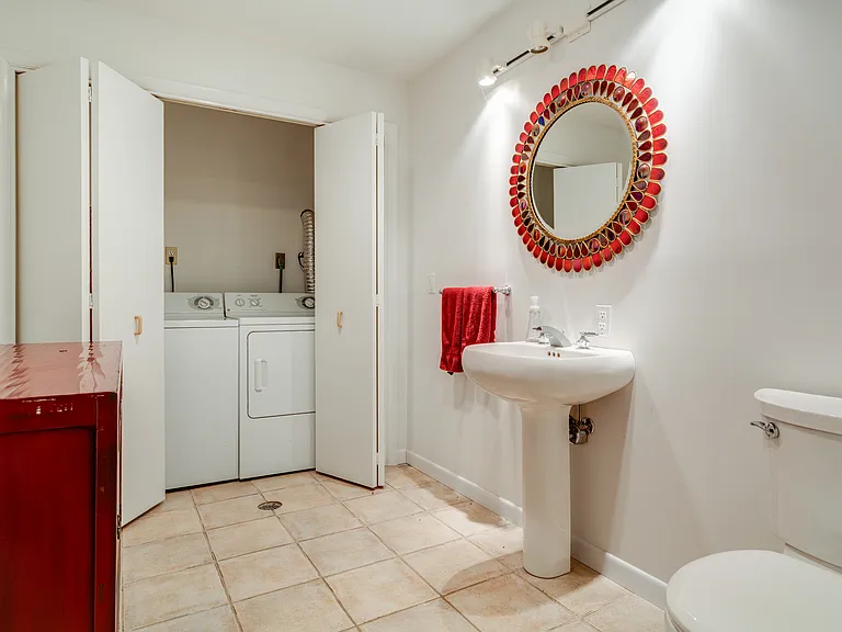 Half bath on lower level, with laundry facilities.