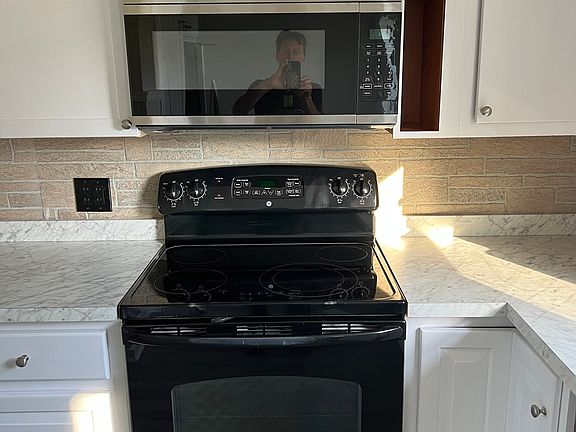 Glass top range and new OTR microwave.