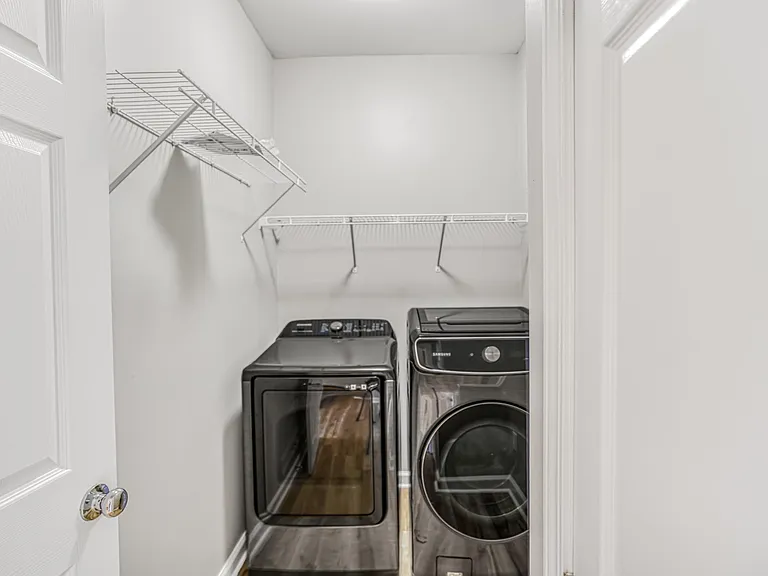 Walk in laundry room with top of the line Bespoke Samsung appliances