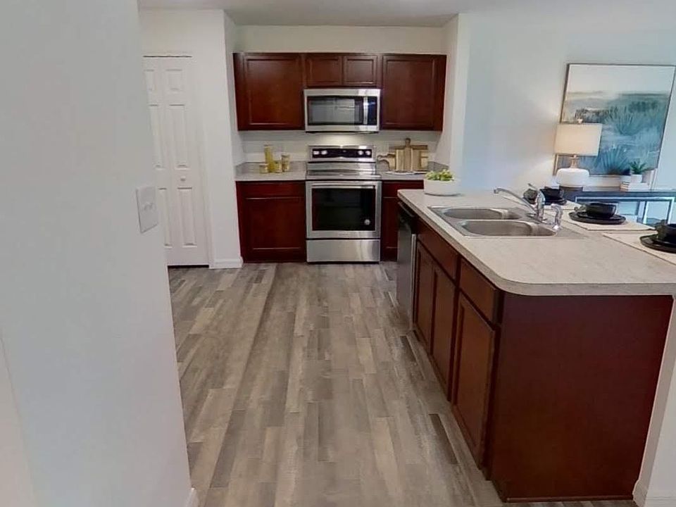 pictures from model home this home has the same layout and cabinets in the kitchen are white. new photos coming soon
