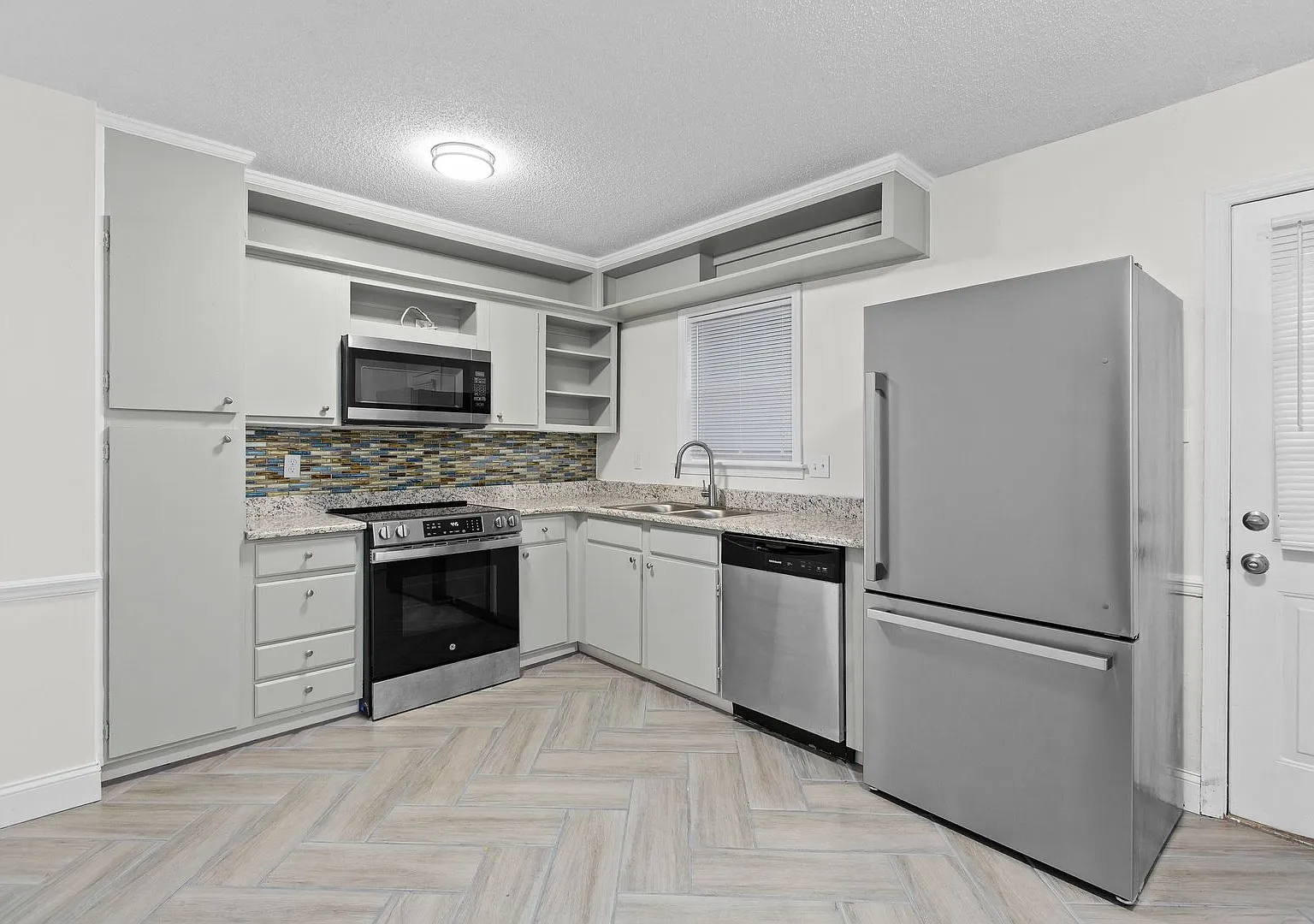 Updated Two-Bedroom Condo with New Kitchen Appliances and Private Patio — Photo 3