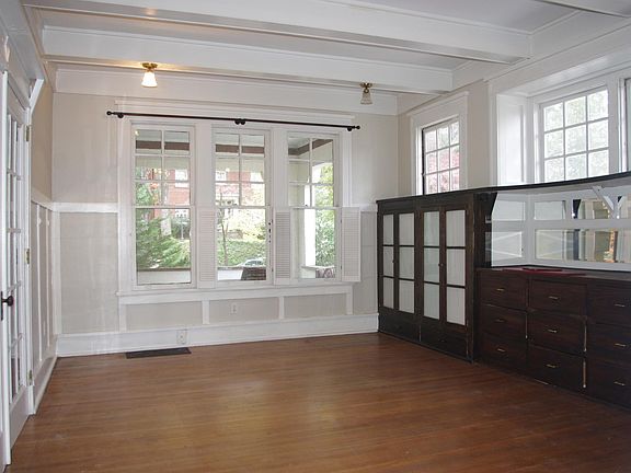 Dining room with original built-in cabinets and buffet