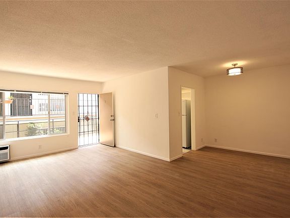 Living room has new floors & new AC. Lots of sunlight & large closet.