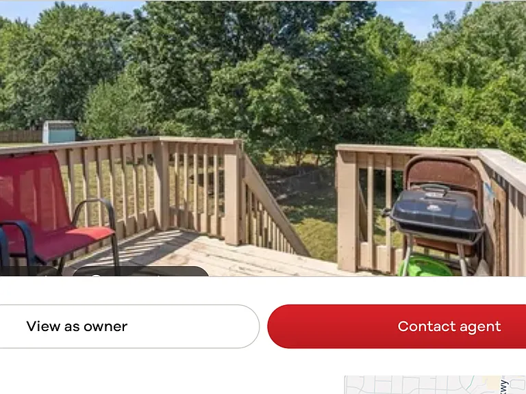 Balcony overlooking back yard. Accessible from dining room. Stairs from balcony descend to back yard.