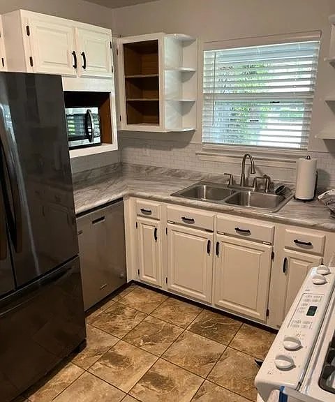 kitchen with new frig, dishwasher