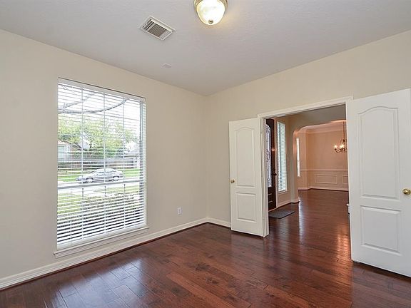 The hardwoods extend into this spacious study.