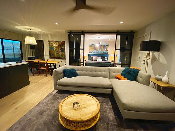 Living Area open to Kitchen w/Sliding Doors to Master - Gives it an open loft feel