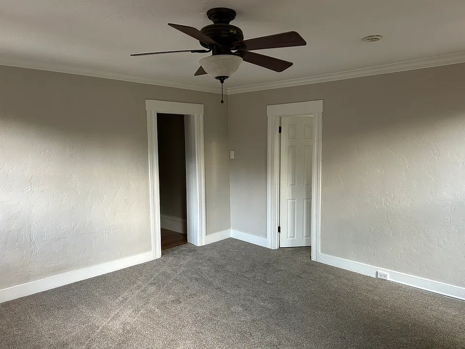 Living room facing hallway and bedroom.