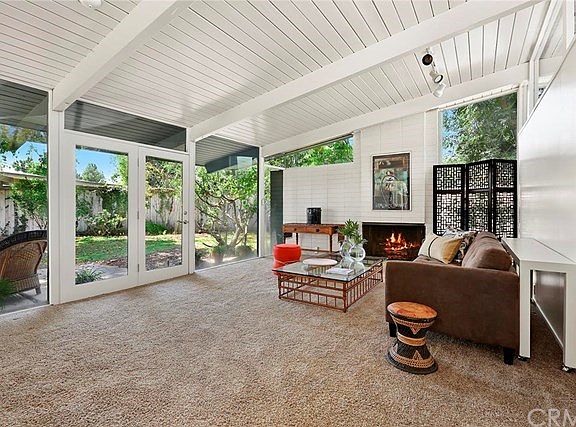 Tall Beamed ceilings with walls of glass.