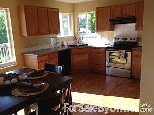 Kitchen/Dining area
						:
						Black and stainless steel appliances