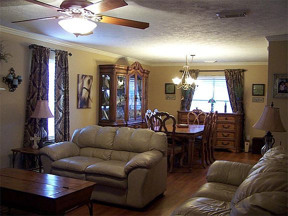 Den to formal dining; fireplace