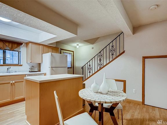Deck off kitchen to the right of the refrigerator will also be getting an upgrade!  Decks are a great size and super-usable - they're about to be super-stylish too!  Notice under-the-stairs storage cubbies.