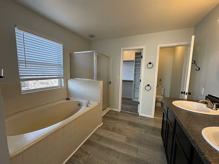 Giant soaking tub and walk-in closet; private toilet