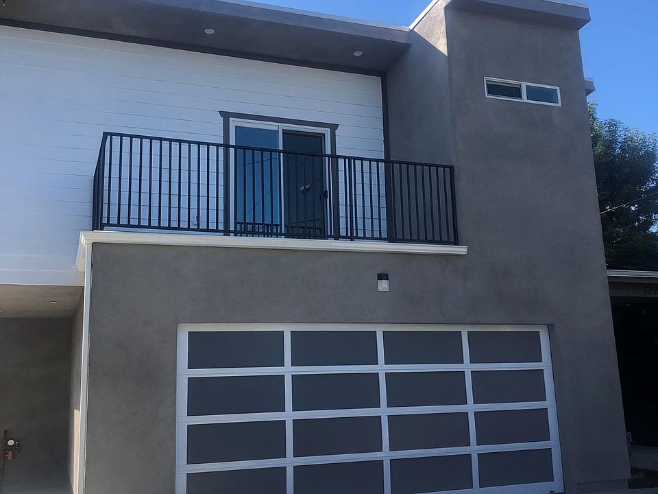 Front House with master bedroom balcony.