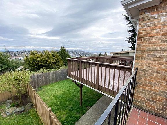 Deck and fenced backyard